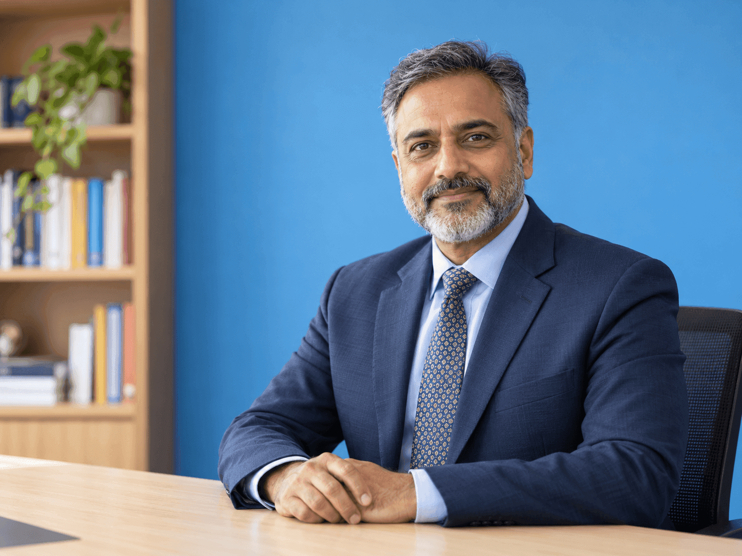Smiling school principal in a suit